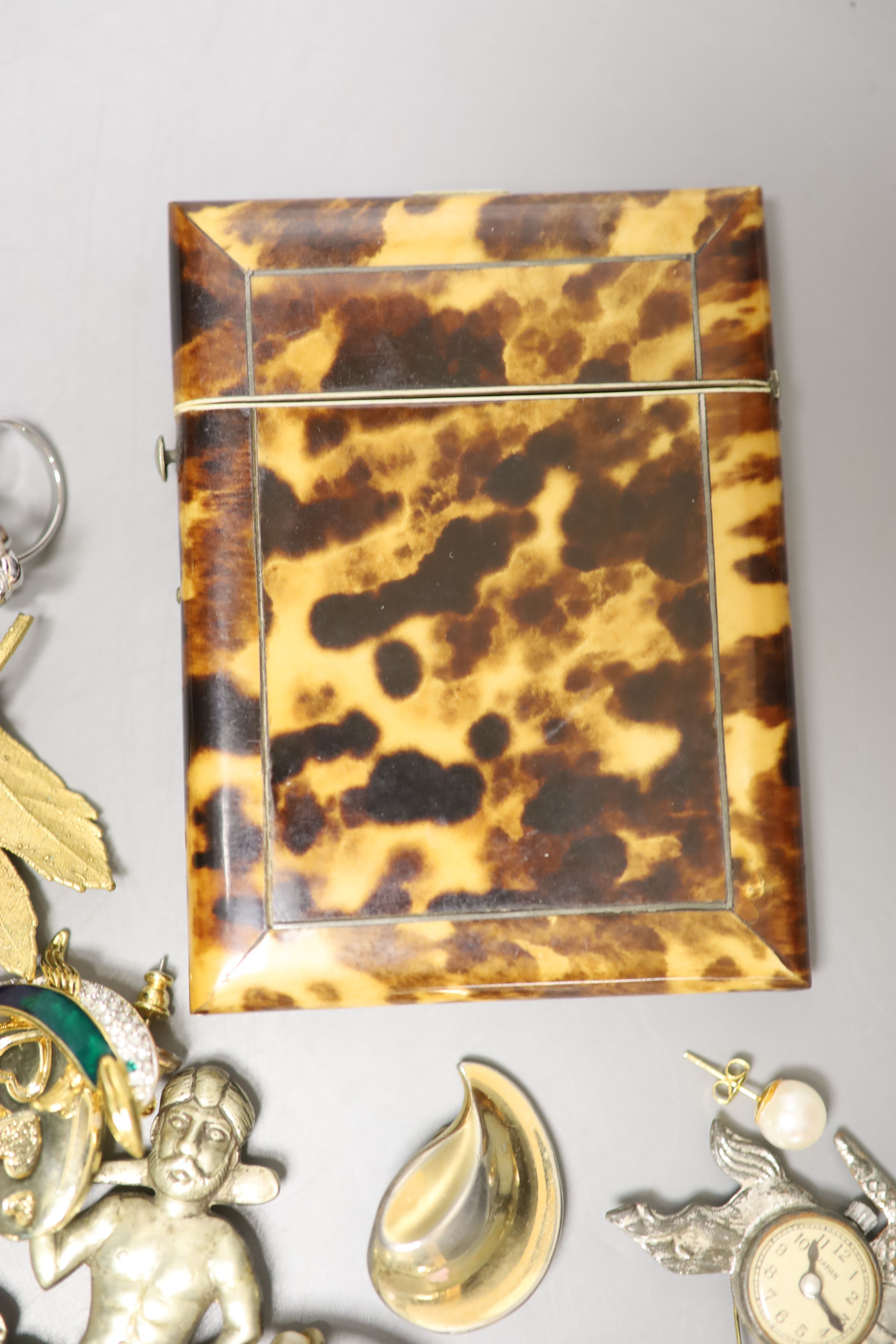 A 19th century tortoiseshell card case, 10.2cm, a pair of 14k and cultured pearl ear studs and a group of minor costume jewellery.